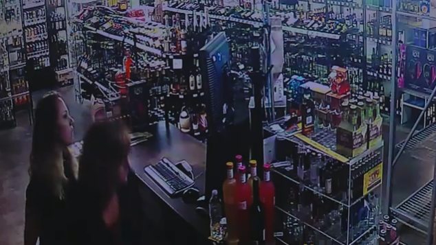 Watch: Liquor store owner, daughter fight back during armed robbery ...