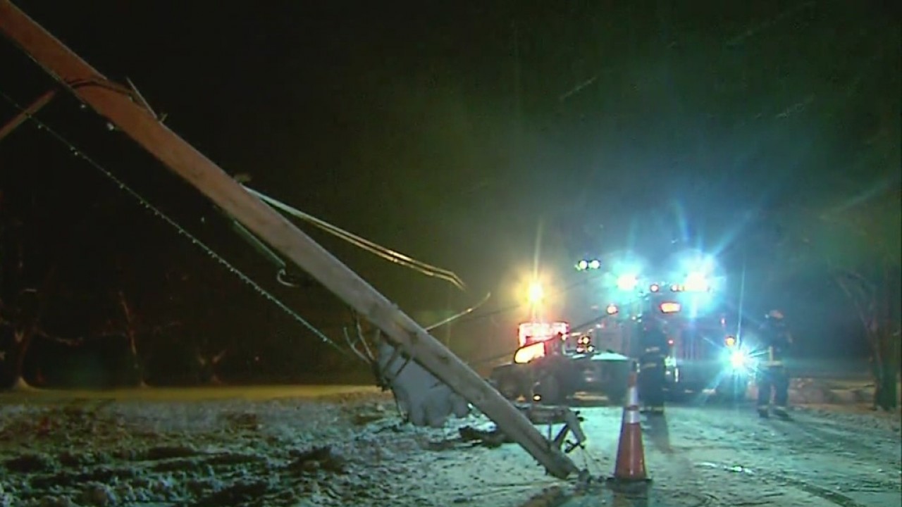 Driver trapped in car after hitting utility pole, knocking out area ...