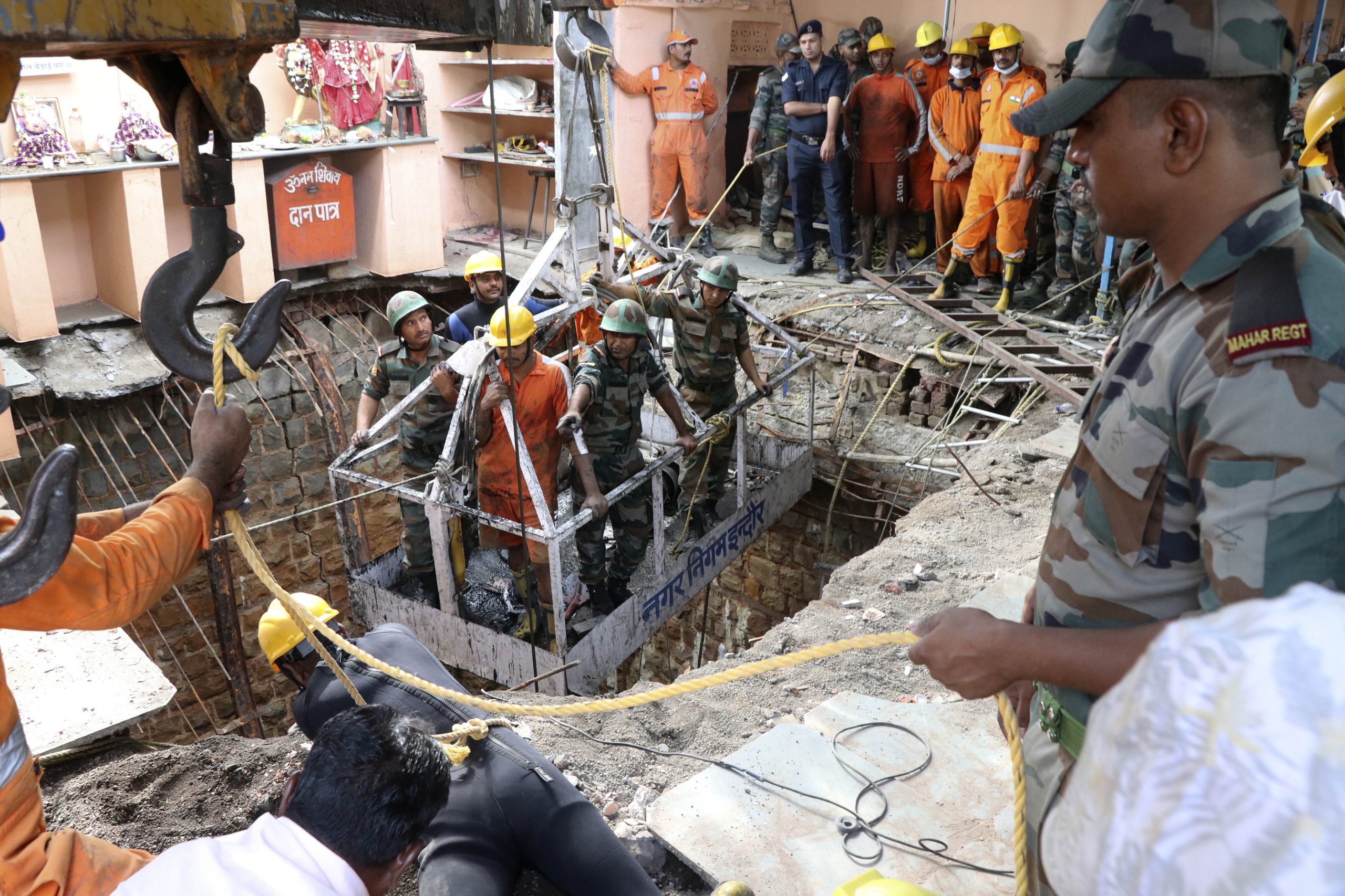 36 bodies found inside well after collapse at Indian temple ...