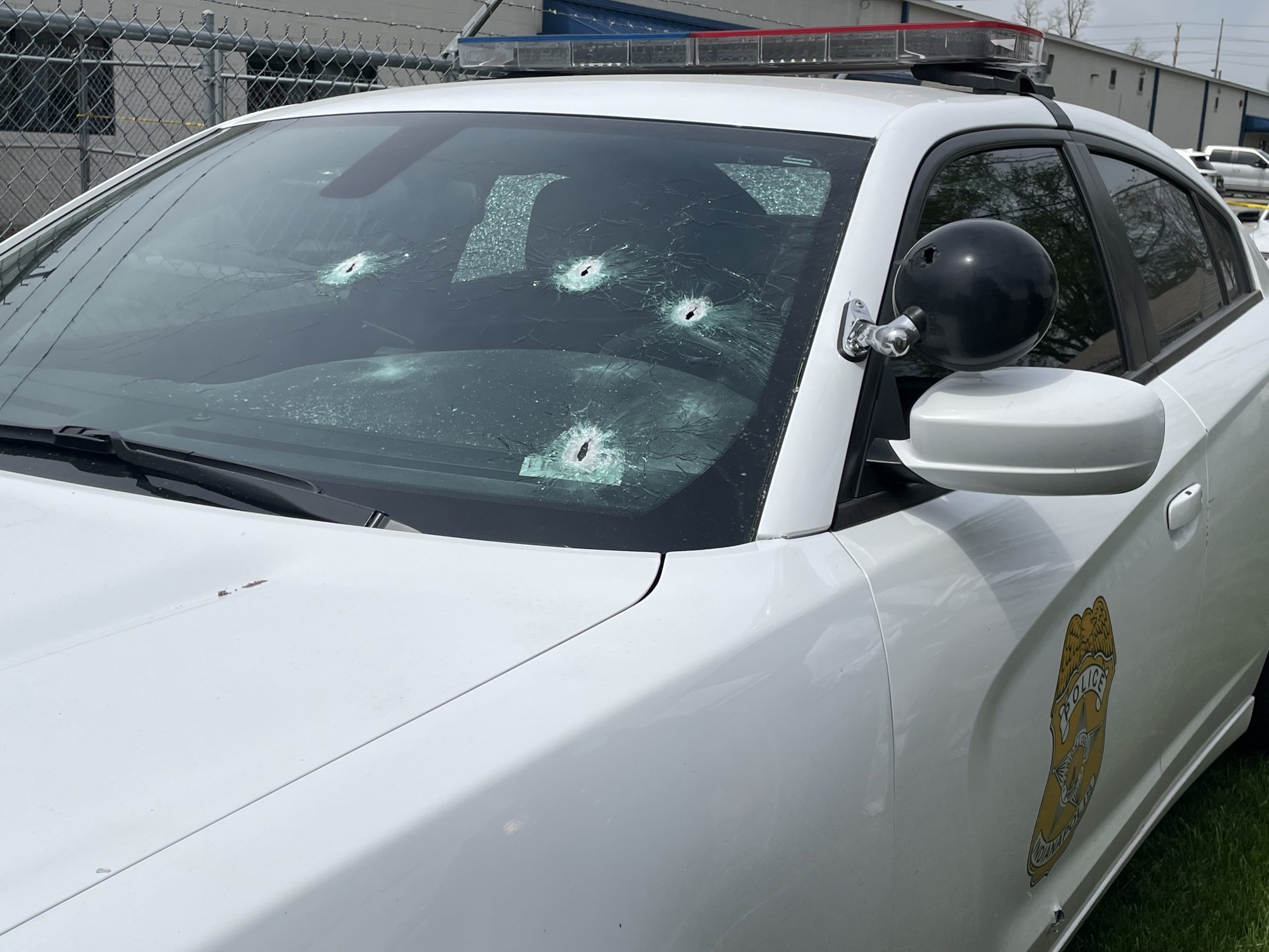 2 officers shot, driver dead, 1 in custody after police pursuit leads ...