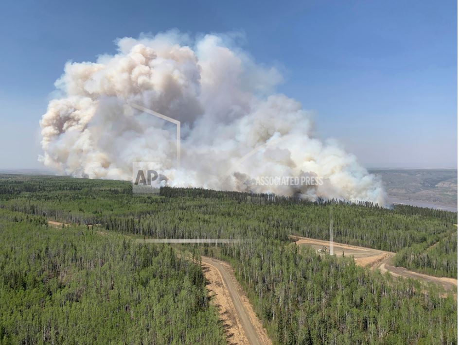 Out-of-control wildfires cause evacuations in western Canada ...