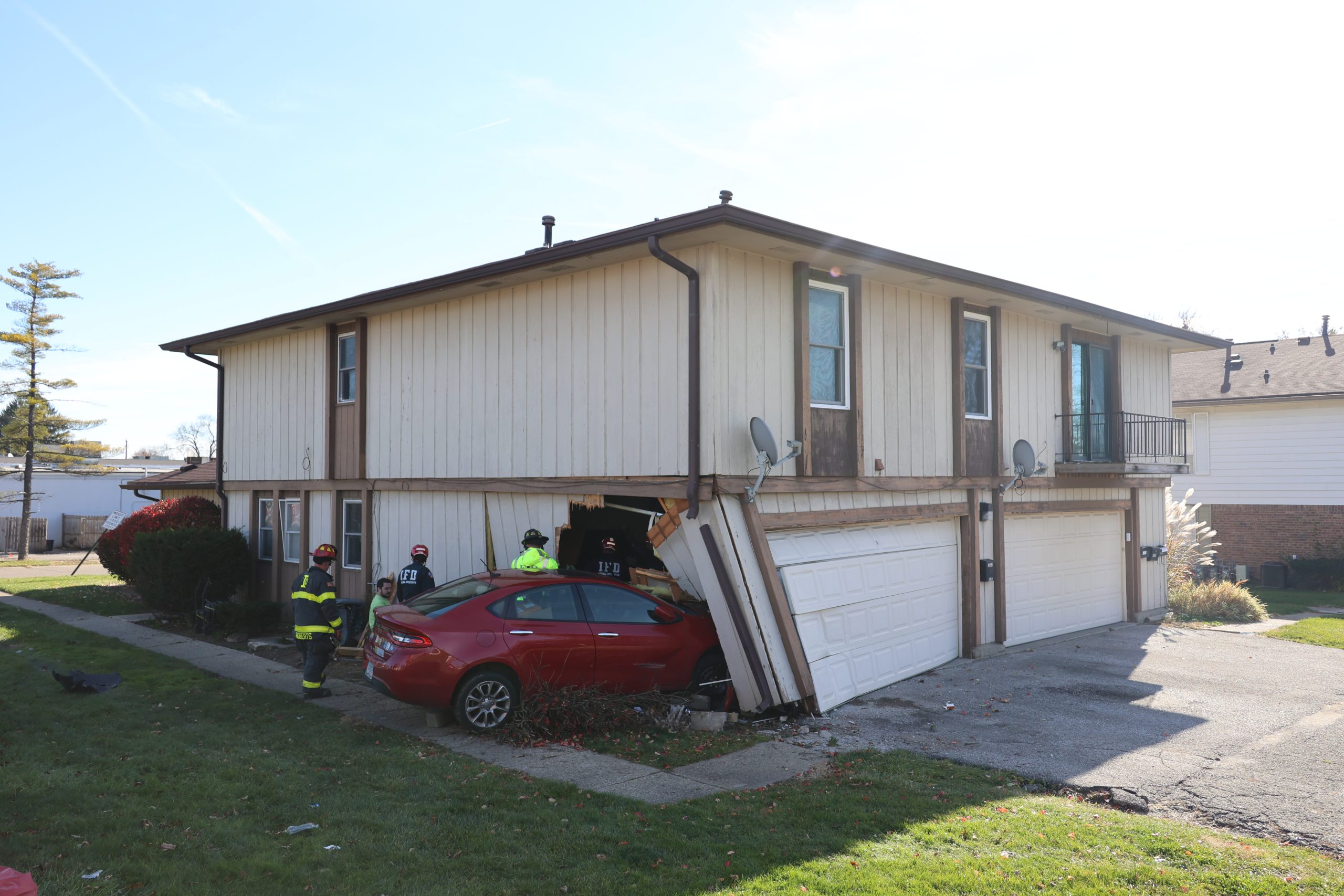 Driver hospitalized after crashing car into condo on Indy's west side ...
